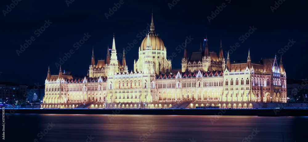 Illuminated Hungary parliament residence on bank of Danube at night, Budapest