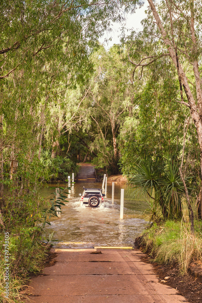 four wheel drive crossing a dangerous creek, Kakadu NP, NT, Australia four wheel drive crossing a dangerous creek, Kakadu NP, NT, Australia