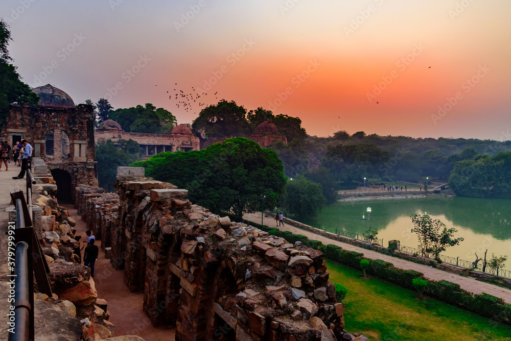 Sunset view of the landmark Hauz Khas Complex, a medieval village complex with lake that is now a tourist attraction in Delhi.