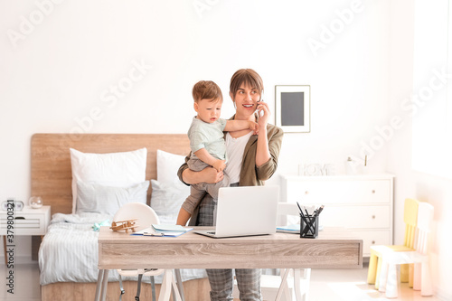 Working mother with little ...
