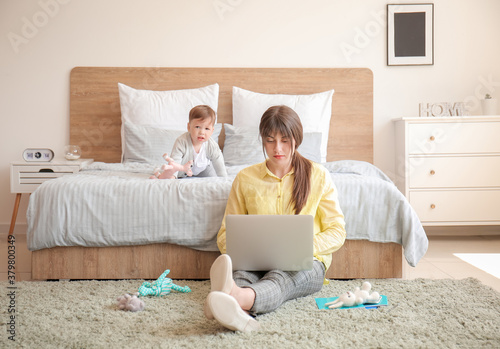 Working mother with little ...