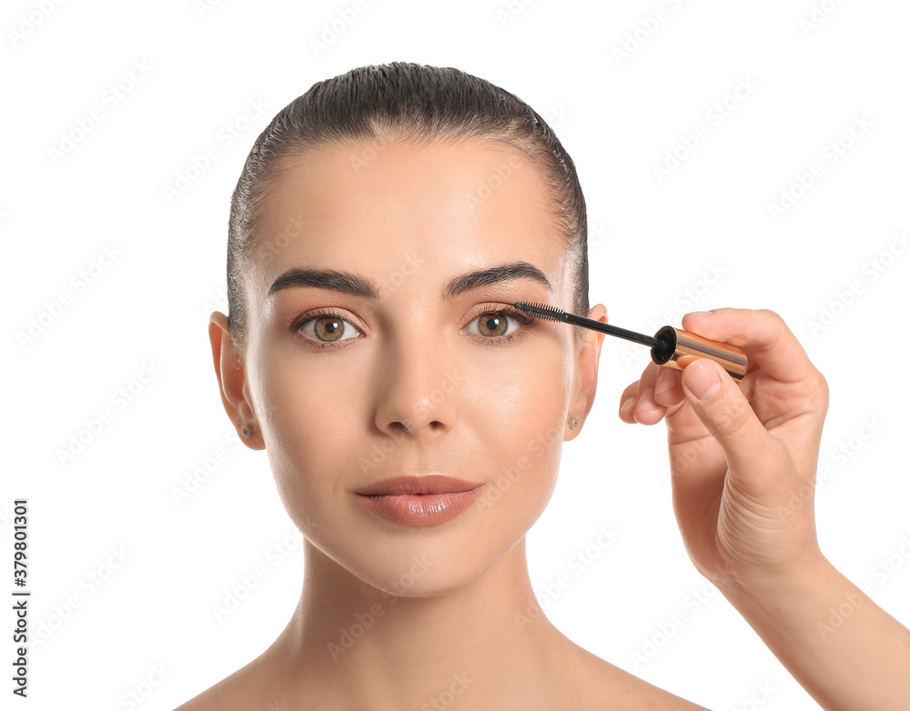 Makeup artist working with beautiful young woman on white background Makeup artist working with beautiful young woman on white background