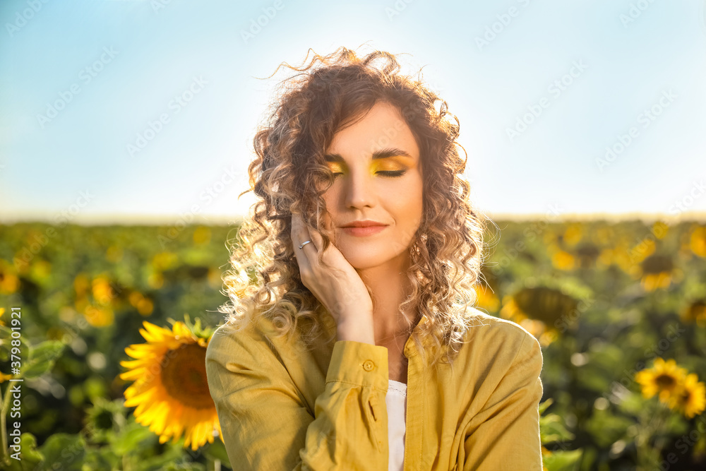 Beautiful young woman in sunflower field Beautiful young woman in sunflower field