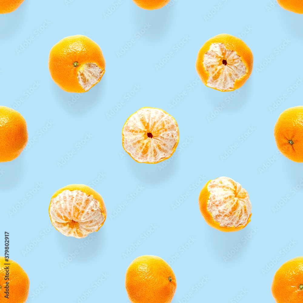 Fresh mandarine Seamles pattern. Ripe fruit tangerines seamless pattern. Fresh citrus isolated on blue background pattern. Flat lay of Clementine. Fresh mandarine Seamles pattern. Ripe fruit tangerines seamless pattern. Fresh citrus isolated on blue background pattern. Flat lay of Clementine.
