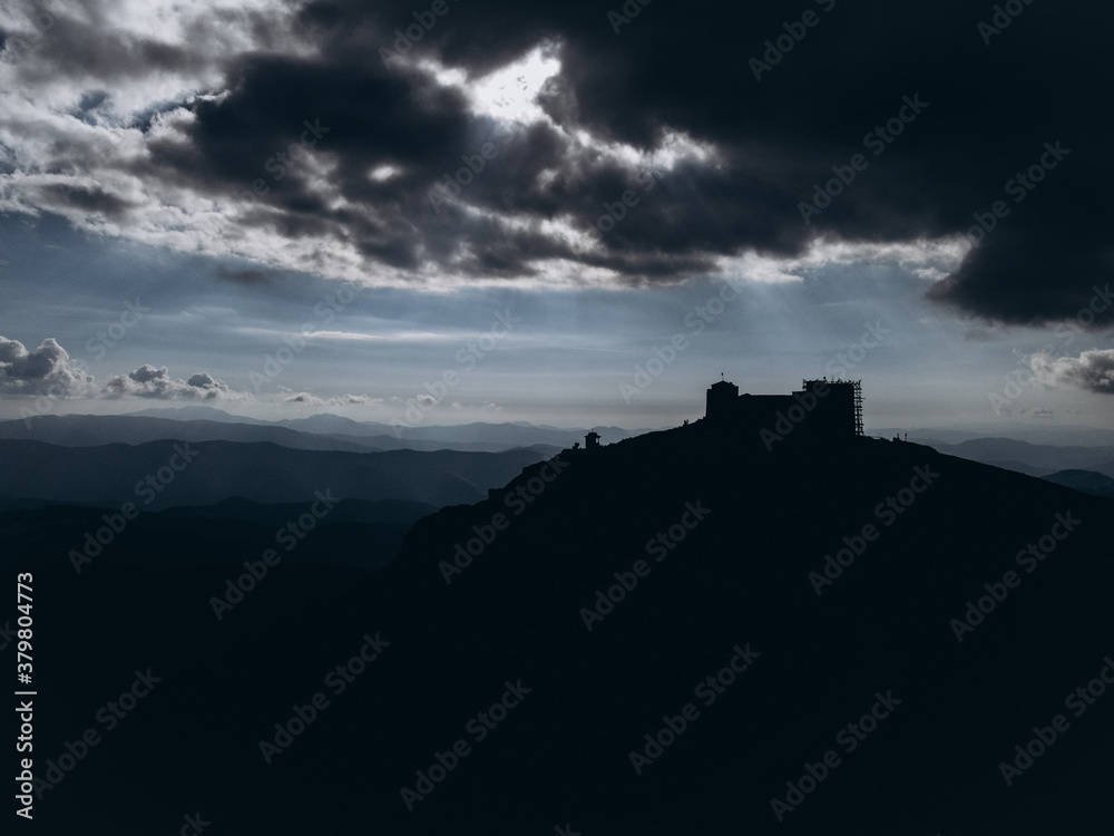 shadow of castle on the hill with dark sky