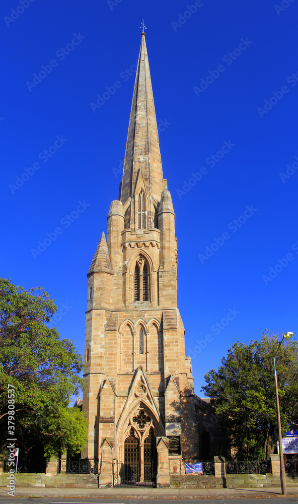 The front of Hunter Baillie Memorial Presbyterian Church.  A heritage listed sandstone church built 1889. An example of Gothic Revival architecture.