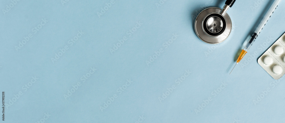 Medical background material and copy space. Stethoscope, syringe and medicine. 医療の背景素材とコピースペース。聴診器と注射器と薬	