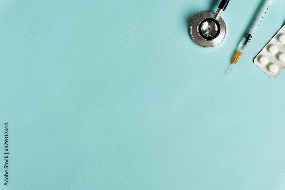 Medical background material and copy space. Stethoscope, syringe and medicine. 医療の背景素材とコピースペース。聴診器と注射器と薬 Medical background material and copy space. Stethoscope, syringe and medicine. 医療の背景素材とコピースペース。聴診器と注射器と薬