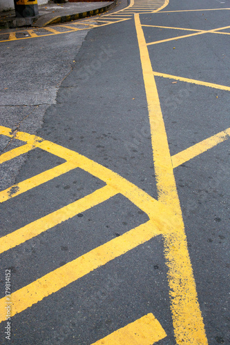 Yellow painted road markings on an intersection. photo