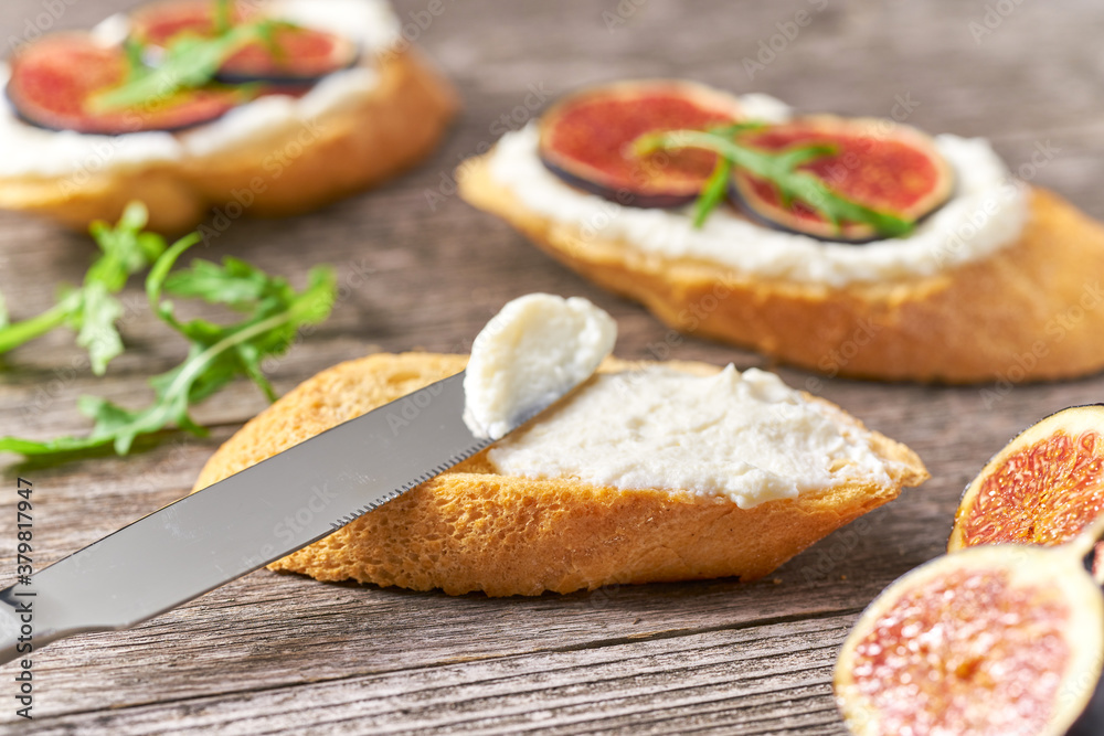 Bread snack with soft white cheese and figs. Healthy vegetarian appetizer. Bread snack with soft white cheese and figs. Healthy vegetarian appetizer.