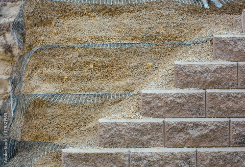 Retaining wall using geo grid for reinforcement