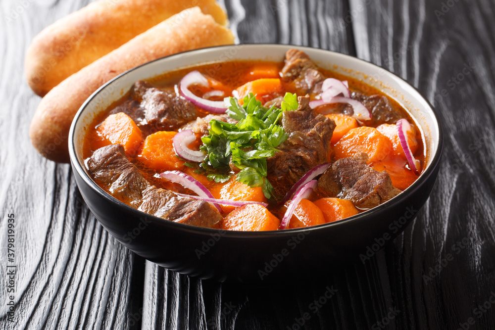 Bo kho is a delicious spicy beef stew dish, that is popular in Vietnam close-up in a bowl on the table. Horizontal Bo kho is a delicious spicy beef stew dish, that is popular in Vietnam close-up in a bowl on the table. Horizontal