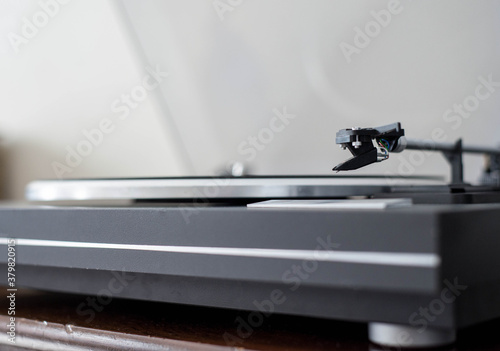 Turntable with stylus resting on base