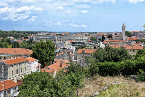 City of Pula with amphitheatre and church tower from distance