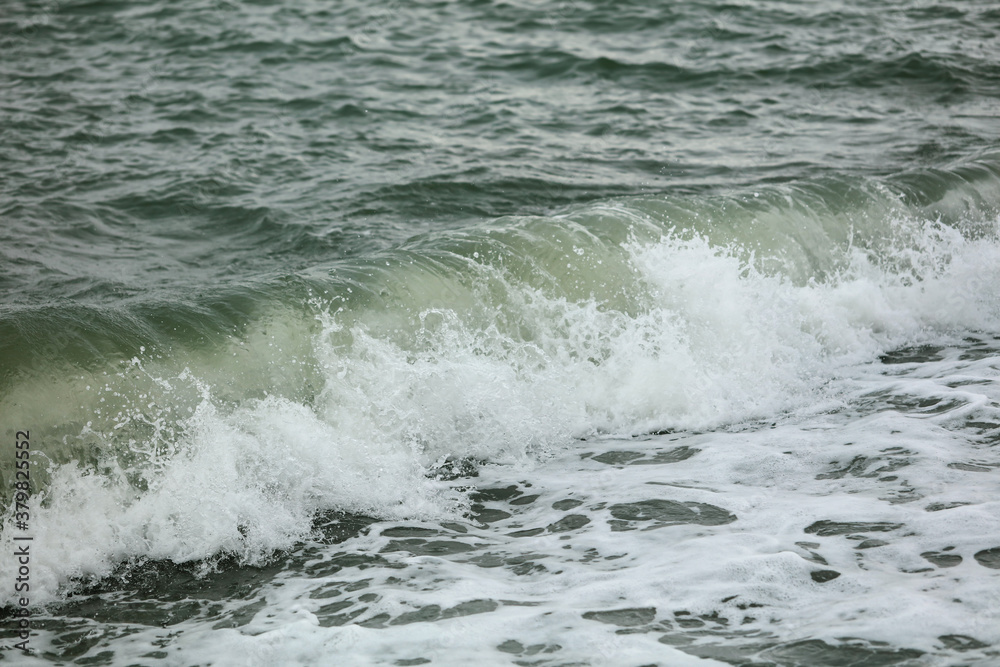 Wave in the sea with splashing water.