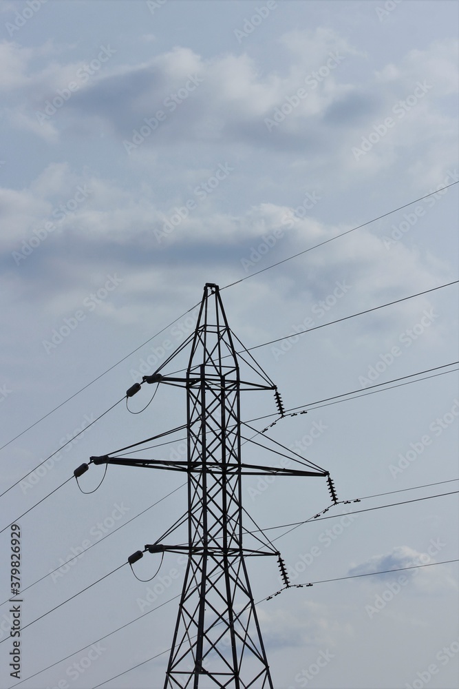 power lines in the sky with white clouds in Hutchinson Kansas USA. power lines in the sky with white clouds in Hutchinson Kansas USA.