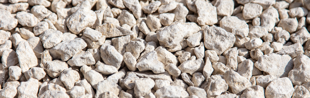 Stone gravel at a construction site as a background. Stone gravel at a construction site as a background.