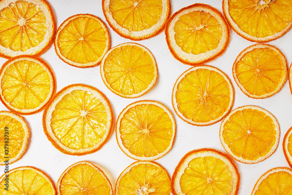 Dried orange slices close-up on the white background