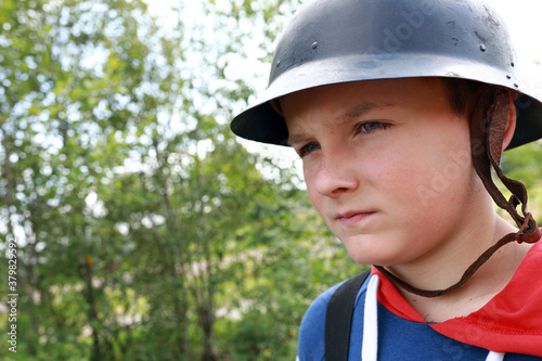 Child in old military helmet