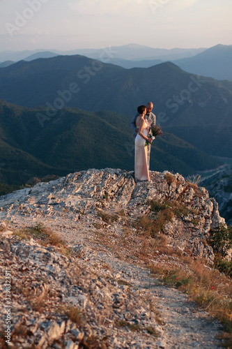 Wedding Couple enyoing the sunset photo