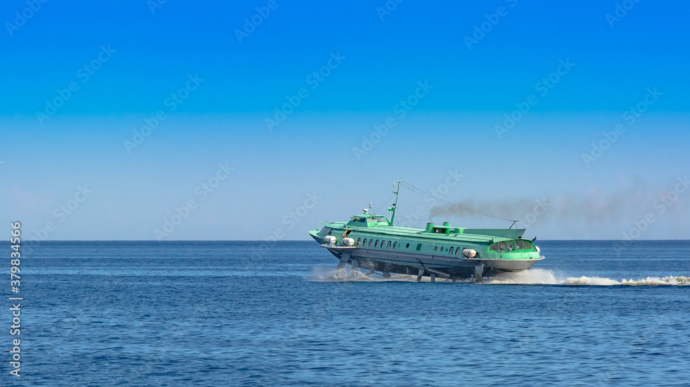 Hydrofoil meteor or comet on Lake Onega. The ship moves on the surface of the lake in a cloud of spray