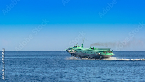 Hydrofoil meteor or comet on Lake Onega. The ship moves on the surface of the lake in a cloud of spray © mangz