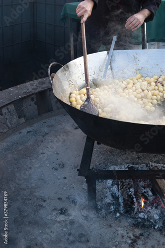 Cooking potatoes at the market photo