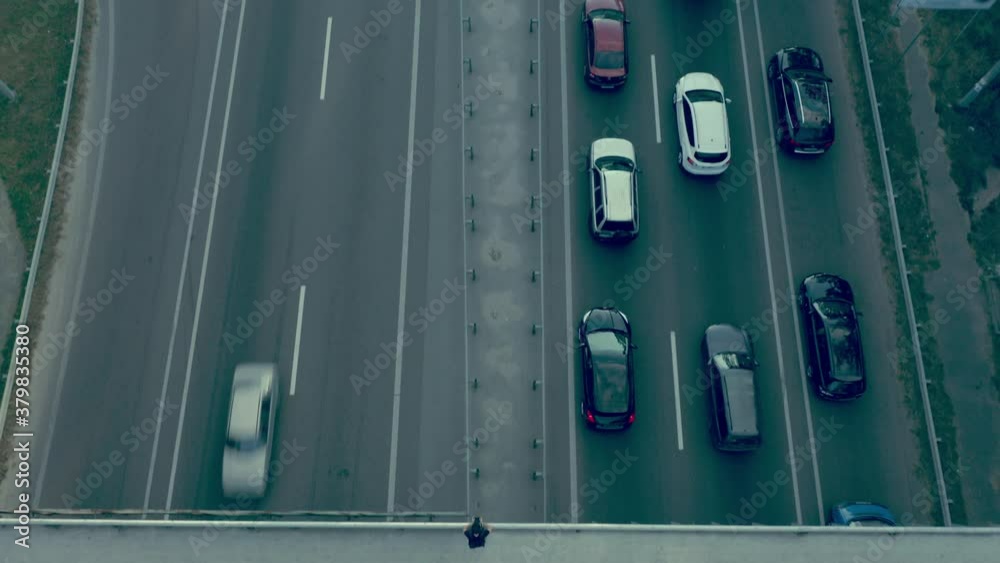 Top view of heavy traffic on suburban road, gas emissions problem, ecology Top view of heavy traffic on suburban road, gas emissions problem, ecology