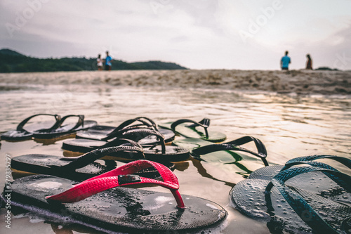 Lost slippers by the beach