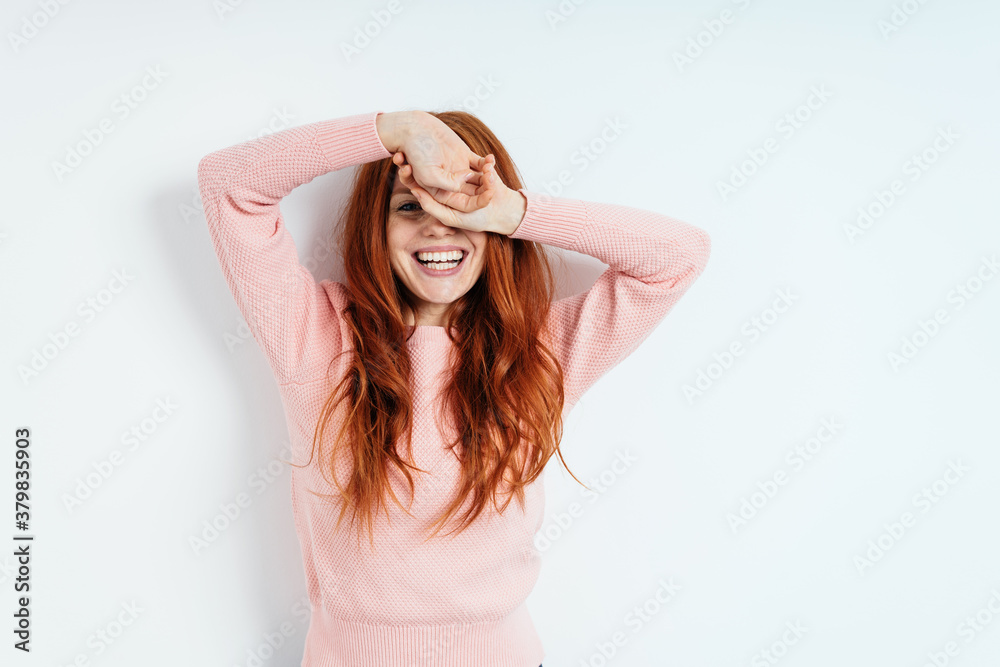 Vivacious laughing young redhead woman on white Vivacious laughing young redhead woman on white
