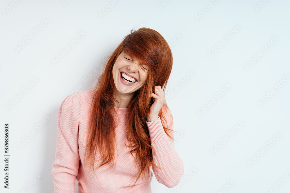 Cute vivacious playful young redhead woman - obrazy, fototapety, plakaty 