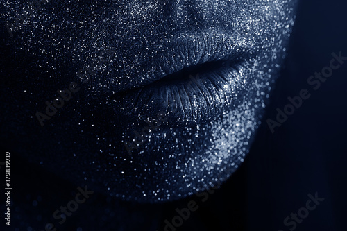 macro lips with blue body art with shiny glitters