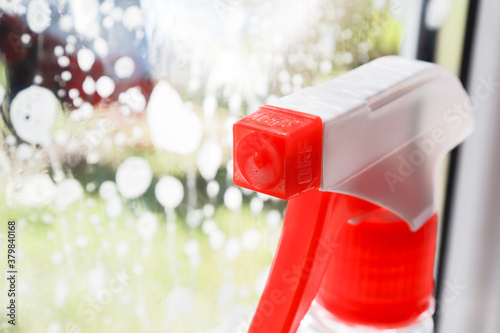 window cleaner close-up on the background of the window. selective focus, Spring cleanup, housework concept, Washing Window