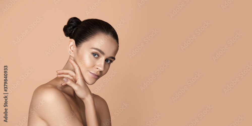 Obraz premium Soft touch. Beautiful face of young woman with clean and fresh skin. Flyer with copyspace for ad. Concept of beauty, healthcare, cosmetics, fashion. Attractive caucasian woman with well-kept skin.
