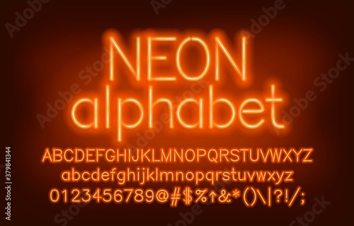 Neon alphabet font. Yellow neon light uppercase and lowercase letters and numbers. Blurred background. Stock vector typescript for your design.