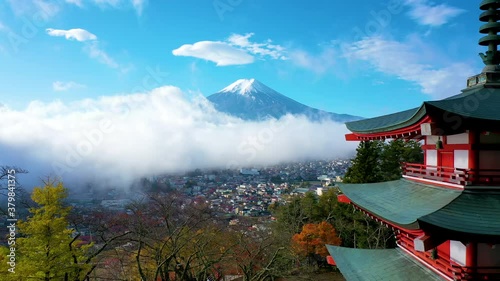Aerial view 4k footage of Mount Fuji and mist view from behind Chureito Pagoda on morning, Yamanashi, Japan. photo