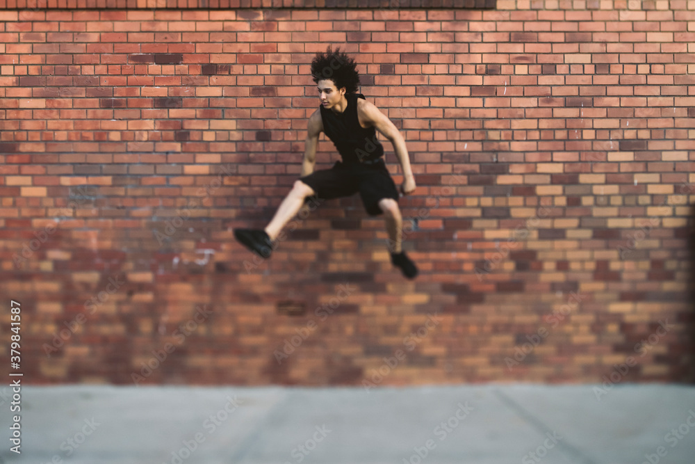 Man jumping against a wall Man jumping against a wall