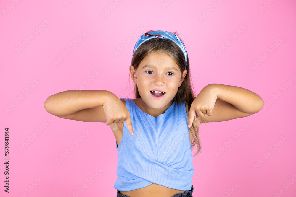 Young beautiful child girl over isolated pink background looking confident with smile on face, pointing oneself with fingers proud and happy. Young beautiful child girl over isolated pink background looking confident with smile on face, pointing oneself with fingers proud and happy.