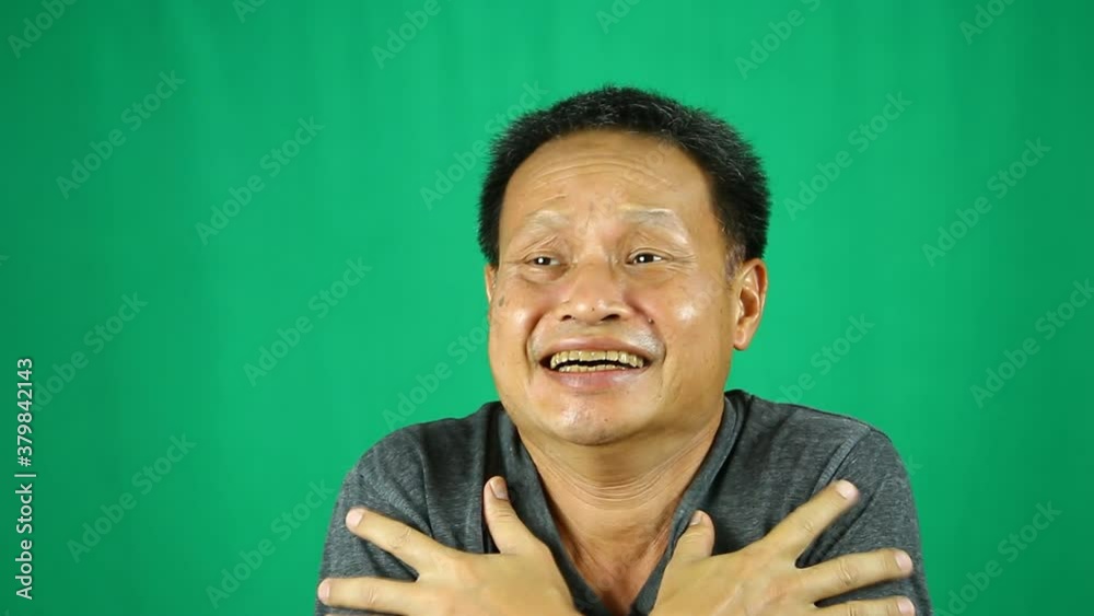 Close up cold man with green background Close up cold man with green background