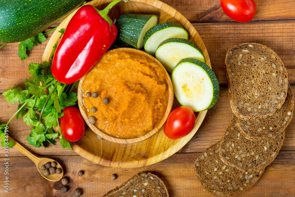 squash caviar on a wooden table, preparation and ingredients squash caviar on a wooden table, preparation and ingredients