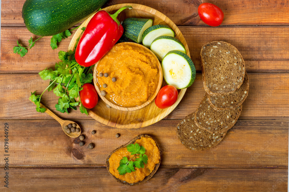 squash caviar on a wooden table, preparation and ingredients squash caviar on a wooden table, preparation and ingredients