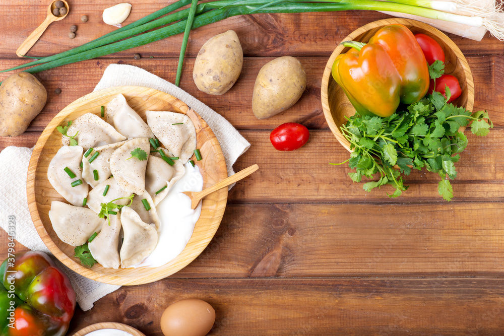dumplings with potatoes on a wooden table dumplings with potatoes on a wooden table