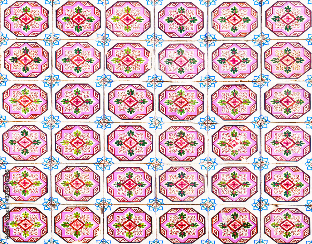 Detail of the traditional tiles from facade of old house. Decorative tiles.Portuguese traditional tiles. Floral ornament. Detail of the traditional tiles from facade of old house. Decorative tiles.Portuguese traditional tiles. Floral ornament.