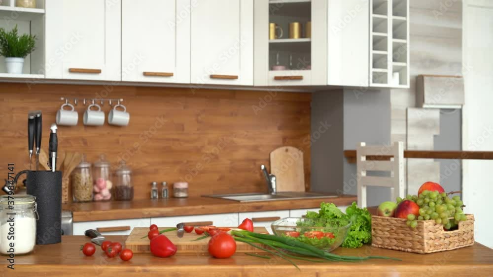 Happy dad and kid daughter cooking together, laughing having fun in modern kitchen Happy dad and kid daughter cooking together, laughing having fun in modern kitchen