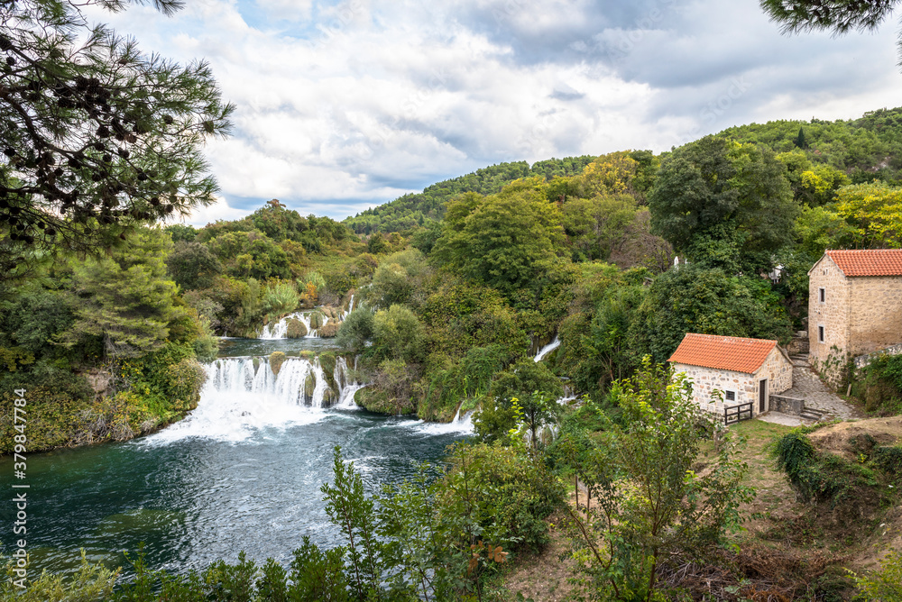 Fototapeta premium Utility house and waterfall in Krka National Park in Croatia