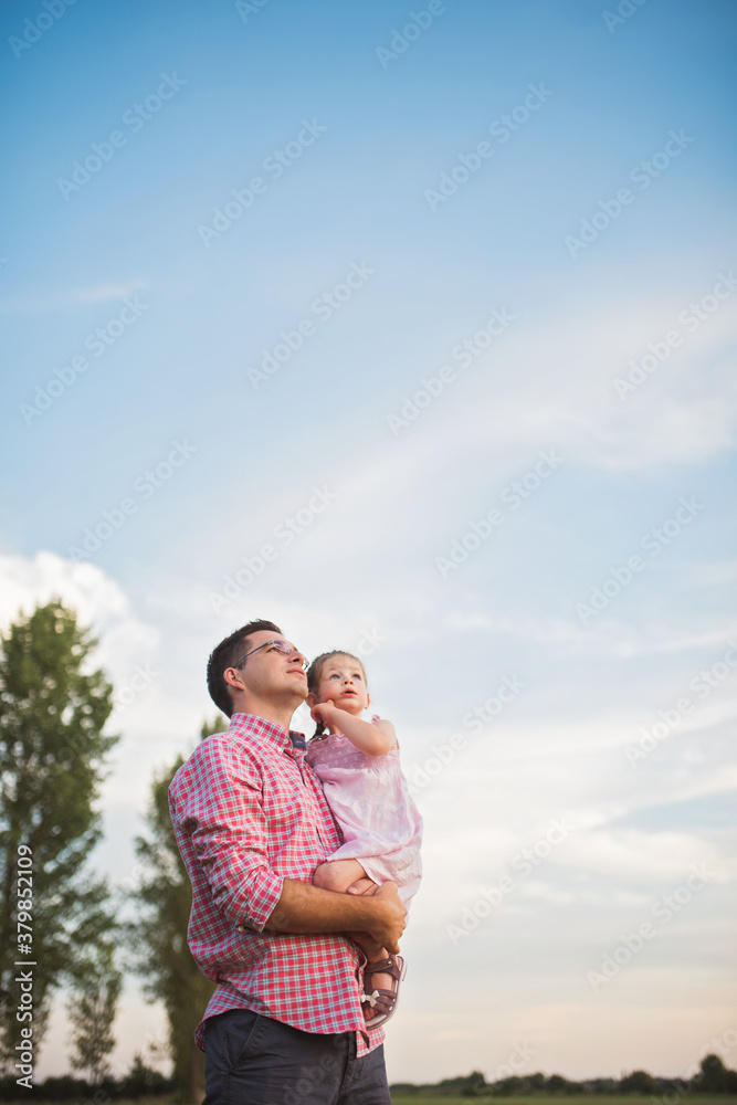 Father and daughter looking at the sky Father and daughter looking at the sky
