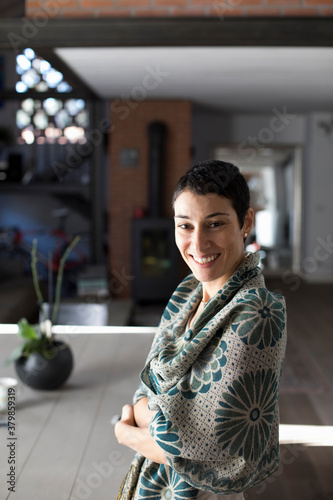 Portrait of smiling woman in her house