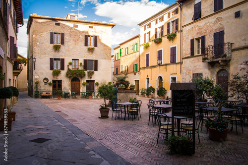 quiet stree in historical city center, coffee tables in Pienza, Italy, Tuscany
