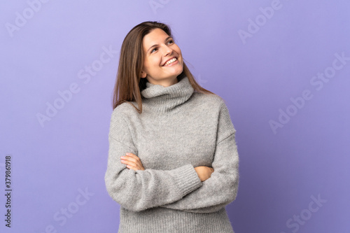 Young Slovak woman isolated on purple background happy and smiling © luismolinero