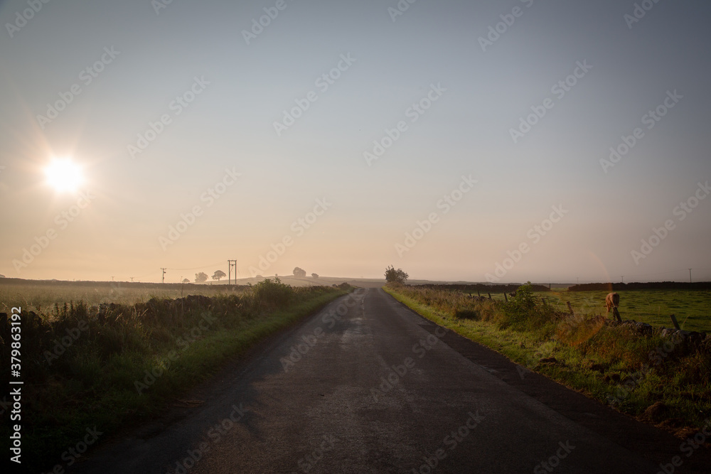 Hazy early morning sunrise on the back road to Bakewell